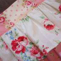 one pink frilly apron